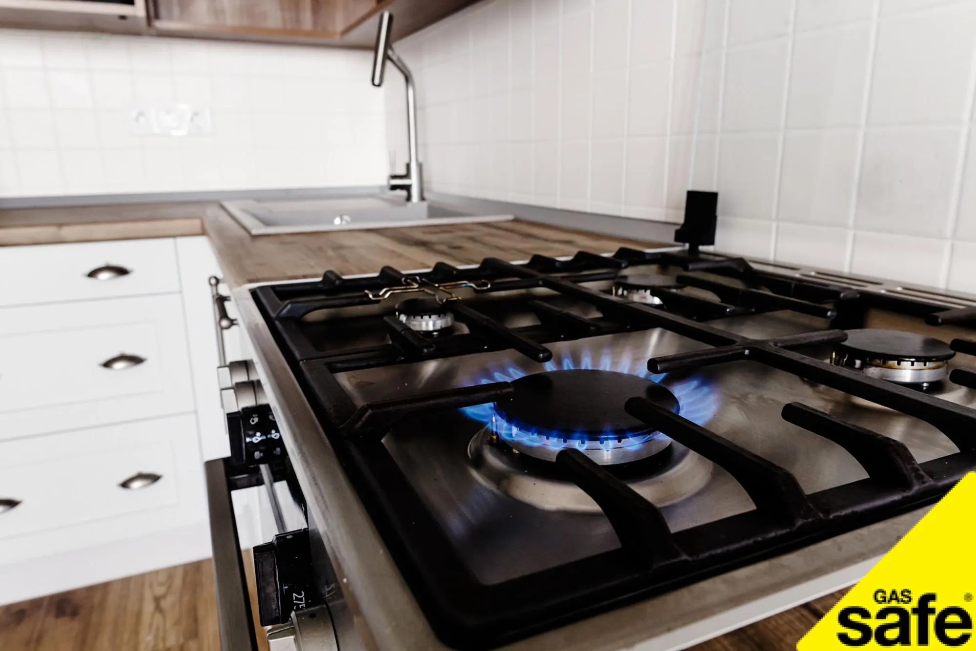 Gas hob burning on a kitchen cooker
